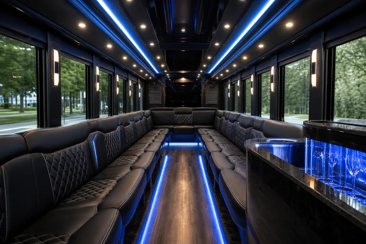 Party bus interior with blue LED lighting along perimeter bench seating